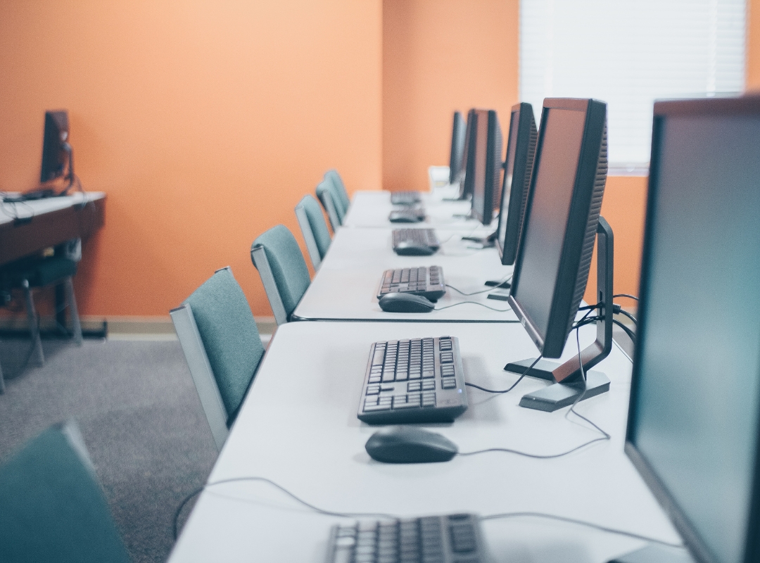 Modern office with desktop computers with Windows 10 and keyboards