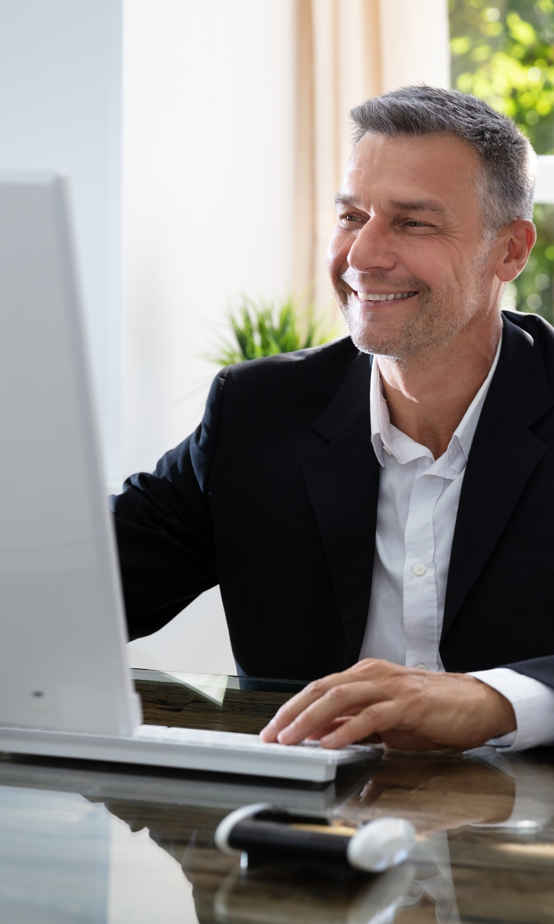Businessman working on computer in Halls Gap